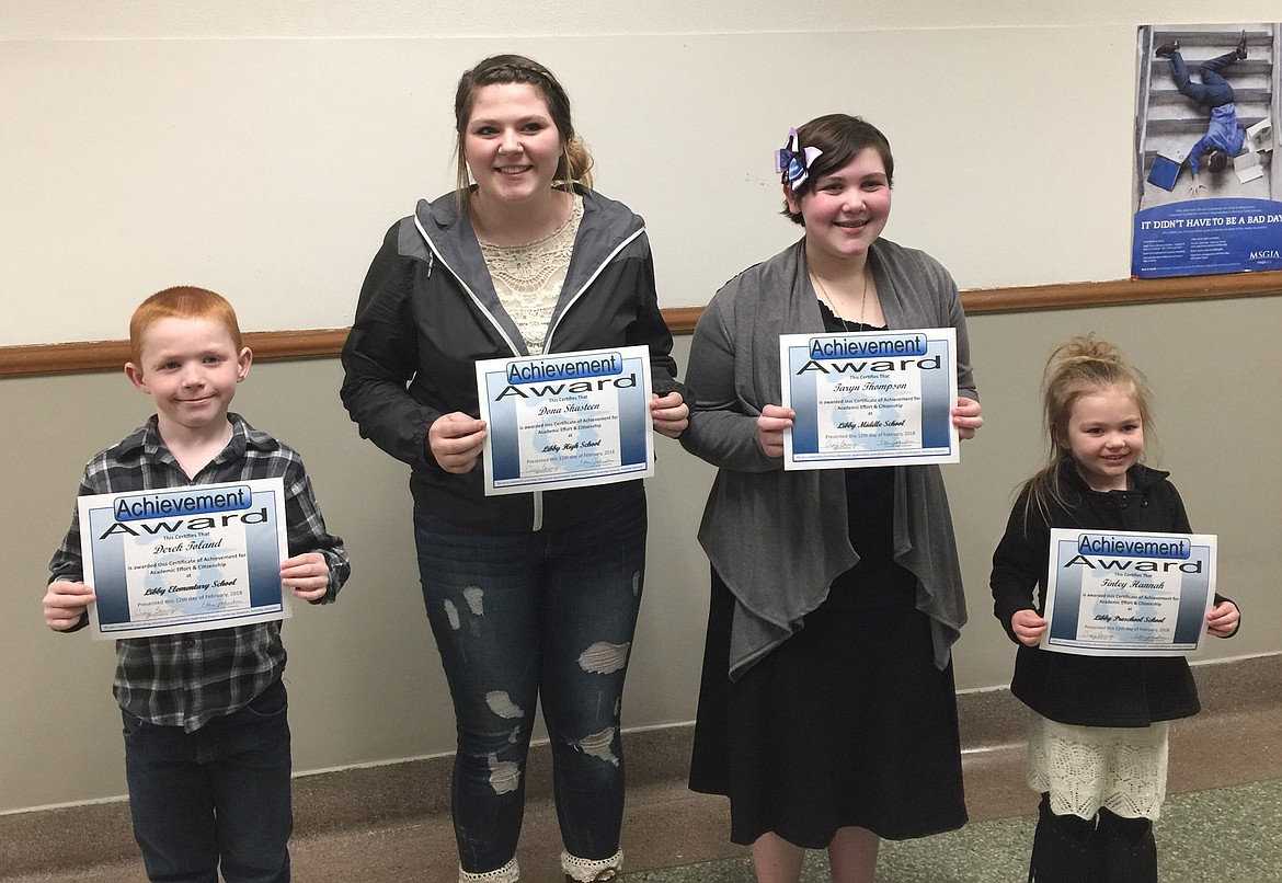 Four Libby students were recognized at the February School Board meeting for their outstanding effort and citizenship in school. Left to right: Derek Toland (Libby Elementary), Dana Shasteen (Libby High School), Taryn Thompson (Libby Middle School) and Finley Hannah (Libby Preschool). (Photo supplied by Craig Barringer)