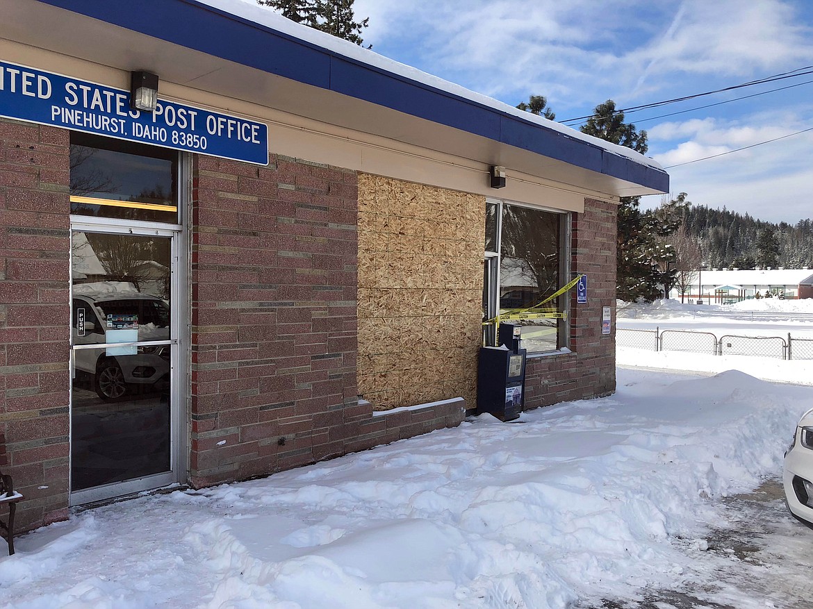 Photo by JOSH MCDONALD
A Saturday crash resulted in the Pinehurst Post Office needing to board up their front window.
