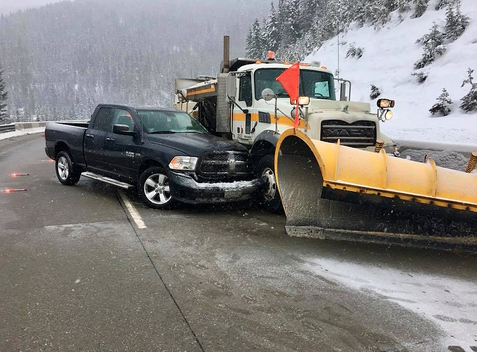 Photo by JOHN MILLER
Crews with Shoshone County Fire District No. 1 respond to a truck sliding into a snow plow on Interstate 90. Just one of many accidents that occured over the weekend.