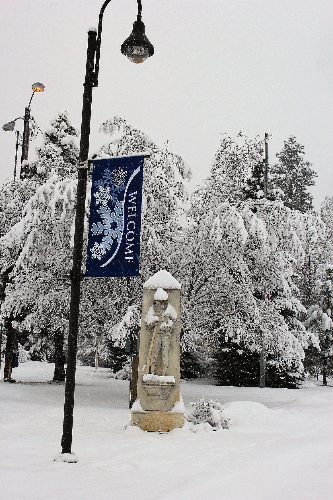 A statue of Capt. John Mullan welcomes guests to St. Regis but an unwelcome snow storm buried the area last weekend dumping up to a foot of snow in places and causing severe driving conditions. (Kathleen Woodford/Mineral Independent)