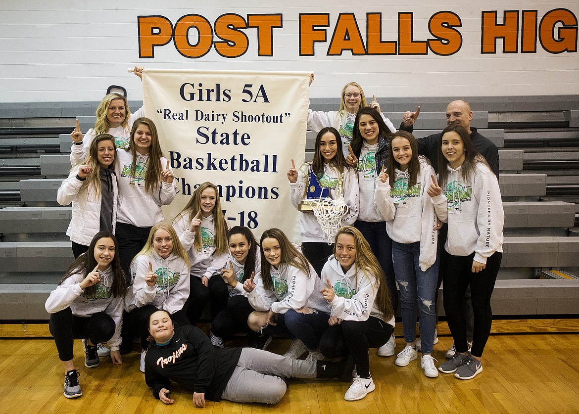 The Post Falls girls basketball team poses with their 5A State Championship trophy Monday afternoon at school. (LOREN BENOIT/Press)