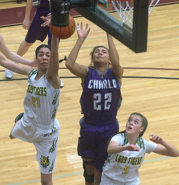 St. Regis&#146; Justice Tate goes in for a basket against a Charlo player during the District 14C championship game in Pablo on Saturday,, Feb. 17. The Tigers lost, 37-17, and will play a challenge game against Arlee on Monday evening for second place. (Jason Blasco, Lake County Leader).