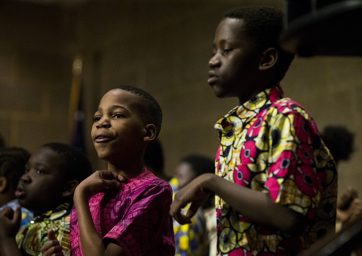 LOREN BENOIT/Press
Didier Wilondja, left, and Semi Mungualinipa and other singers from the Neema Youth Choir sing gospel songs during a refugee awareness event Thursday evening at the Coeur d&#146;Alene Library.