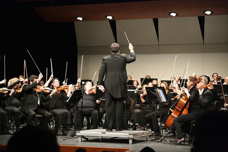 Conductor candidate Pierre-Alain Chevalier from Houston, Texas, ends &#147;Academic Overture&#148; with a flourish at the Coeur d&#146;Alene Symphony Orchestra&#146;s concert on Jan. 20, 2018. The CSO has 66 musicians who play instruments such as flute, bass, oboe, violin, cello and more. (Courtesy photo)