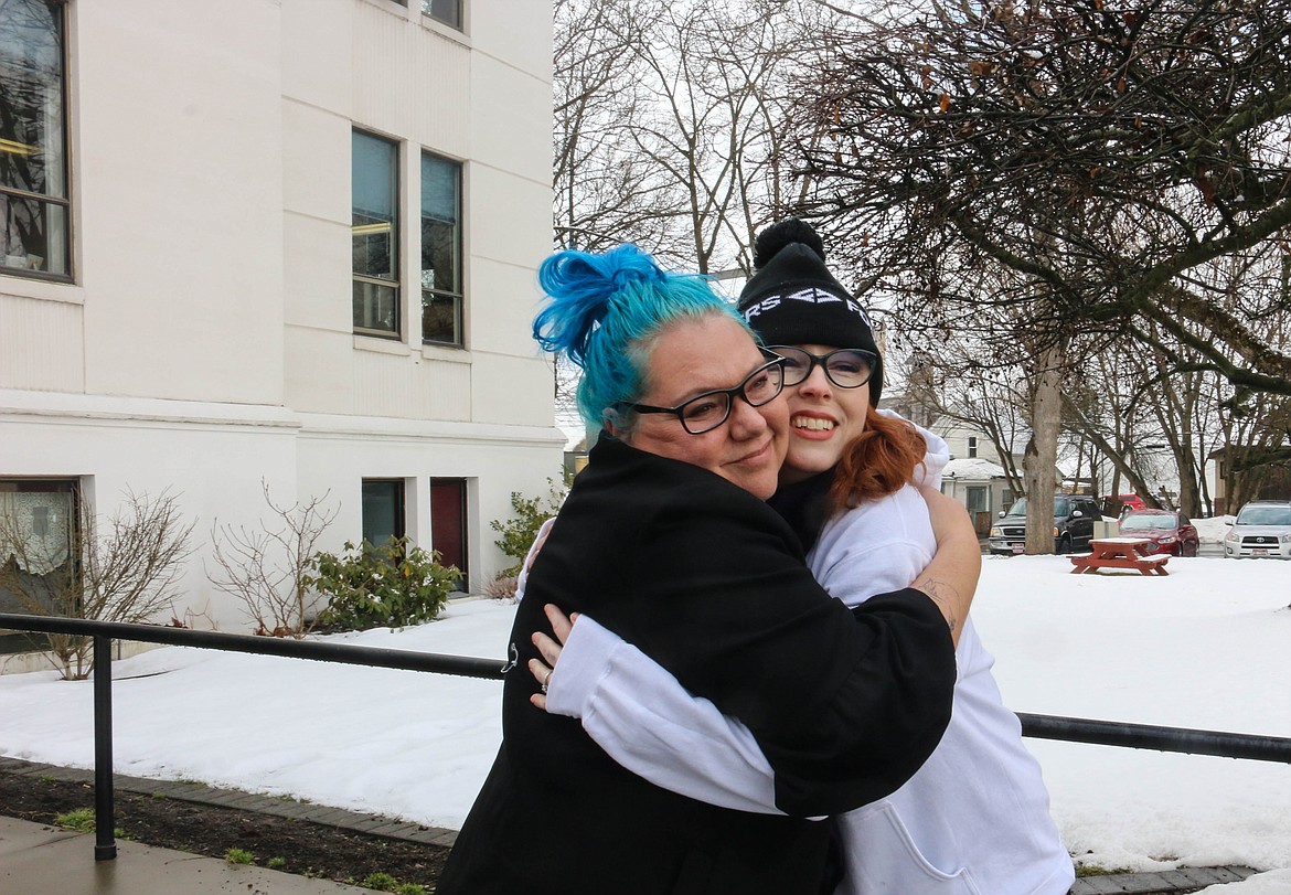 Photo by Mandi Bateman
Shauna Carr gets a hug in front of the courthouse from Leslie Pease, one of her supporters, after getting the news that Eric Dante will be facing trial.