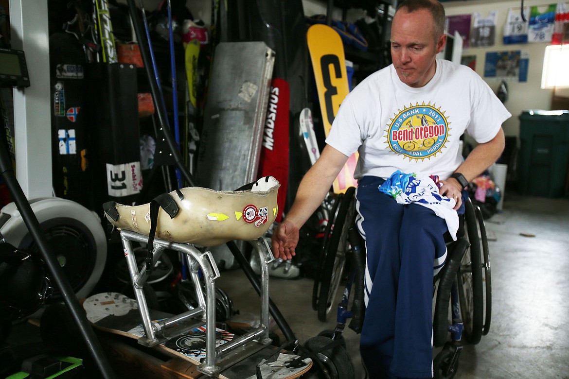 Sean Halsted shows off his training equipment in his Rathdrum garage. (JUDD WILSON/Press)