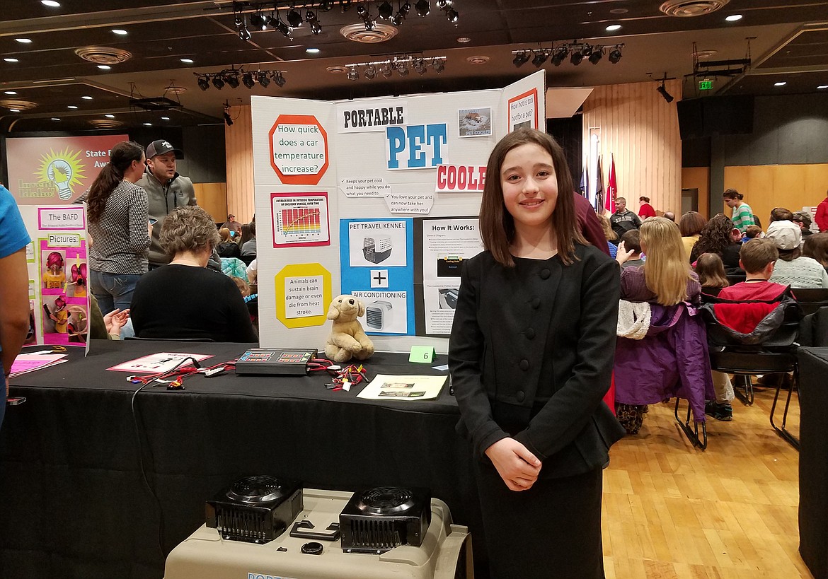 Courtesy photo
Borah Elementary student Mya Donnell smiles for the camera with her invention, the &#147;Portable Pet Cooler,&#148; during the 29th annual Invent Idaho State Finals at the University of Idaho March 2 and 3. Mya placed second in her grade level in the working models category. She was one of 65 North Idaho students who participated this year.