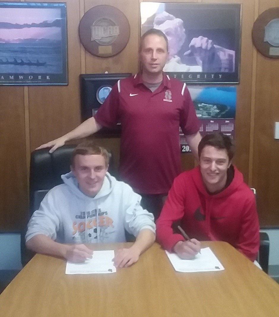 (Courtesy photo)
Sandpoint seniors Christian Dressel, left, and Mac Stultz signed letters of intent last Friday in front of North Idaho College head men&#146;s soccer coach Ken Thompson.