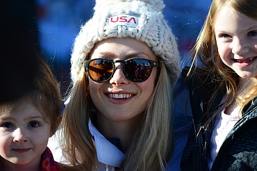 Olympic skier and Whitefish native Maggie Voisin poses for photos with fans outside the O'Shaughnessy Center in Whitefish on Wednesday. (Casey Kreider/Daily Inter Lake)
