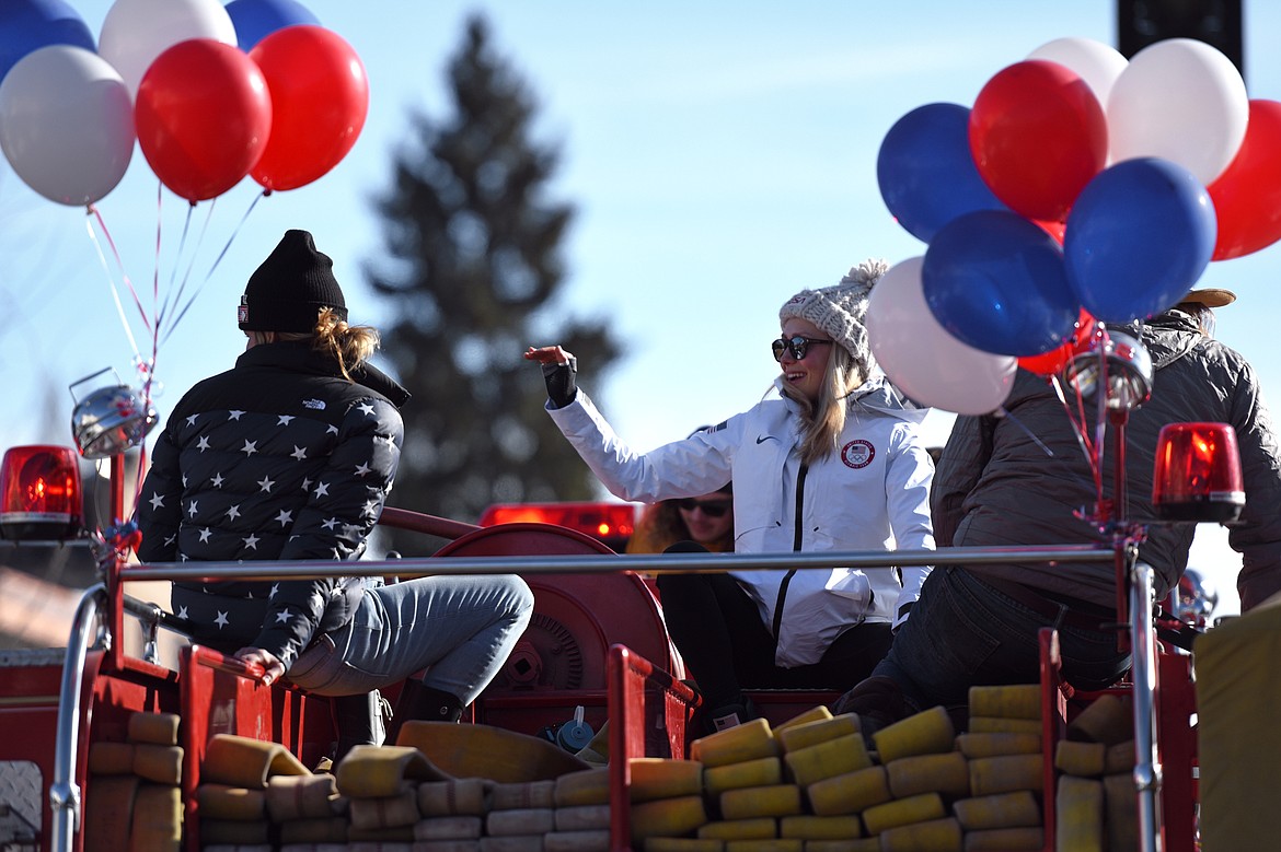 Olympic skier and Whitefish native Maggie Voisin waves to fans during a parade in downtown Whitefish on Wednesday. (Casey Kreider/Daily Inter Lake)