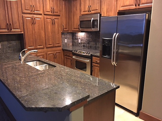 This spacious kitchen can be found in one of the condos in Riverstone managed by North Idaho Rental Company. It falls in the $1,395-$1,550 per month price range. A one-bedroom, roughly 975-square-foot unit that was recently rented out for a reduced price was listed as having magnificent views, all appliances, stacking washer and dryer, gas heat, a small office and underground parking. In North Idaho, $1,500 gives renters much more space than in large cities such as San Francisco or New York City, according to research from www.apartmentlist.com, an apartment search website. (Courtesy photo)