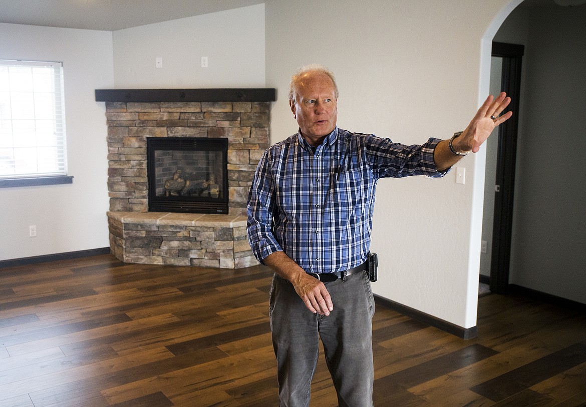 Mark Jensen, president and co-owner of North Idaho Rental Company, describes the amenities of a three- bedroom, two bathroom, 1,630- square-foot single family rental home in Rathdrum, priced at $1,595 a month.

LOREN BENOIT/Press