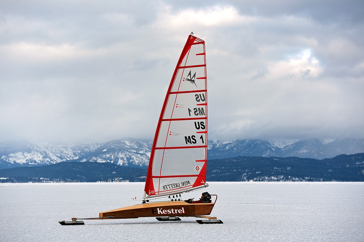 John Eisenlohr of Lakeside sails across the frozen surface of Flathead Lake in Lakeside on Feb. 23. (Casey Kreider/Daily Inter Lake)