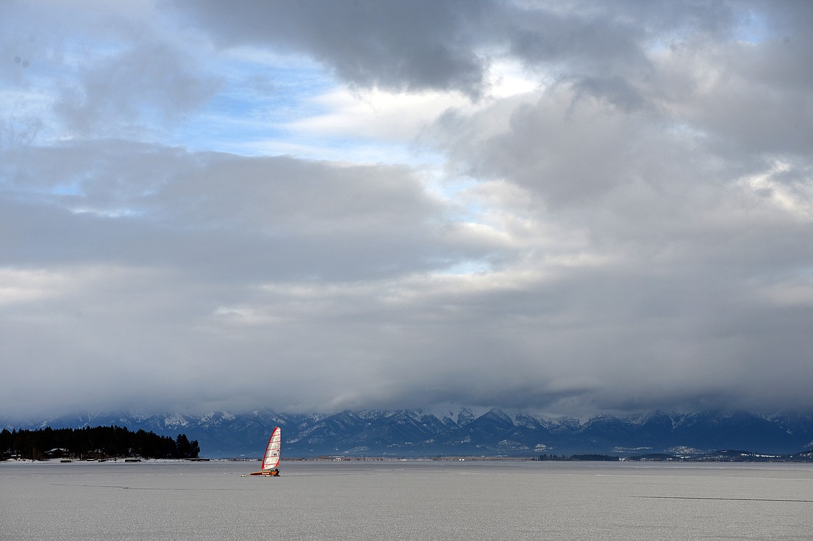 John Eisenlohr sails across the frozen surface of Flathead Lake.