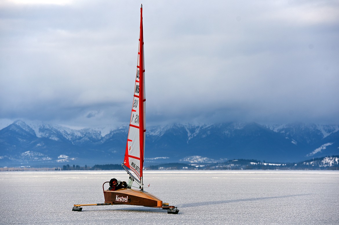 John Eisenlohr of Lakeside sails across the frozen surface of Flathead Lake in Lakeside on Feb. 23. (Casey Kreider/Daily Inter Lake)