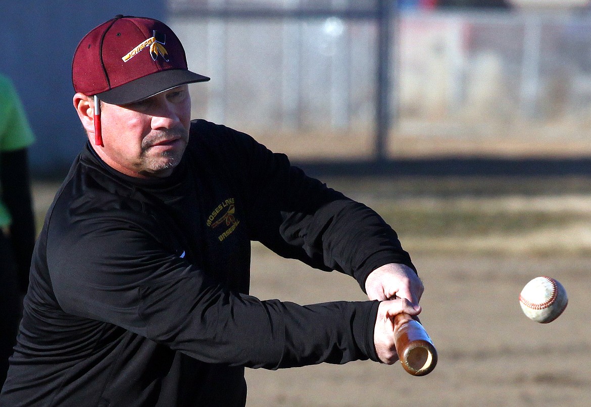 Rodney Harwood/Columbia Basin Herald
First-year Moses Lake head coach Donnie Lindgren lays down a bunt during a drill at Tuesday's practice. The Chiefs open the season on Saturday at the Walla Walla Jamboree.