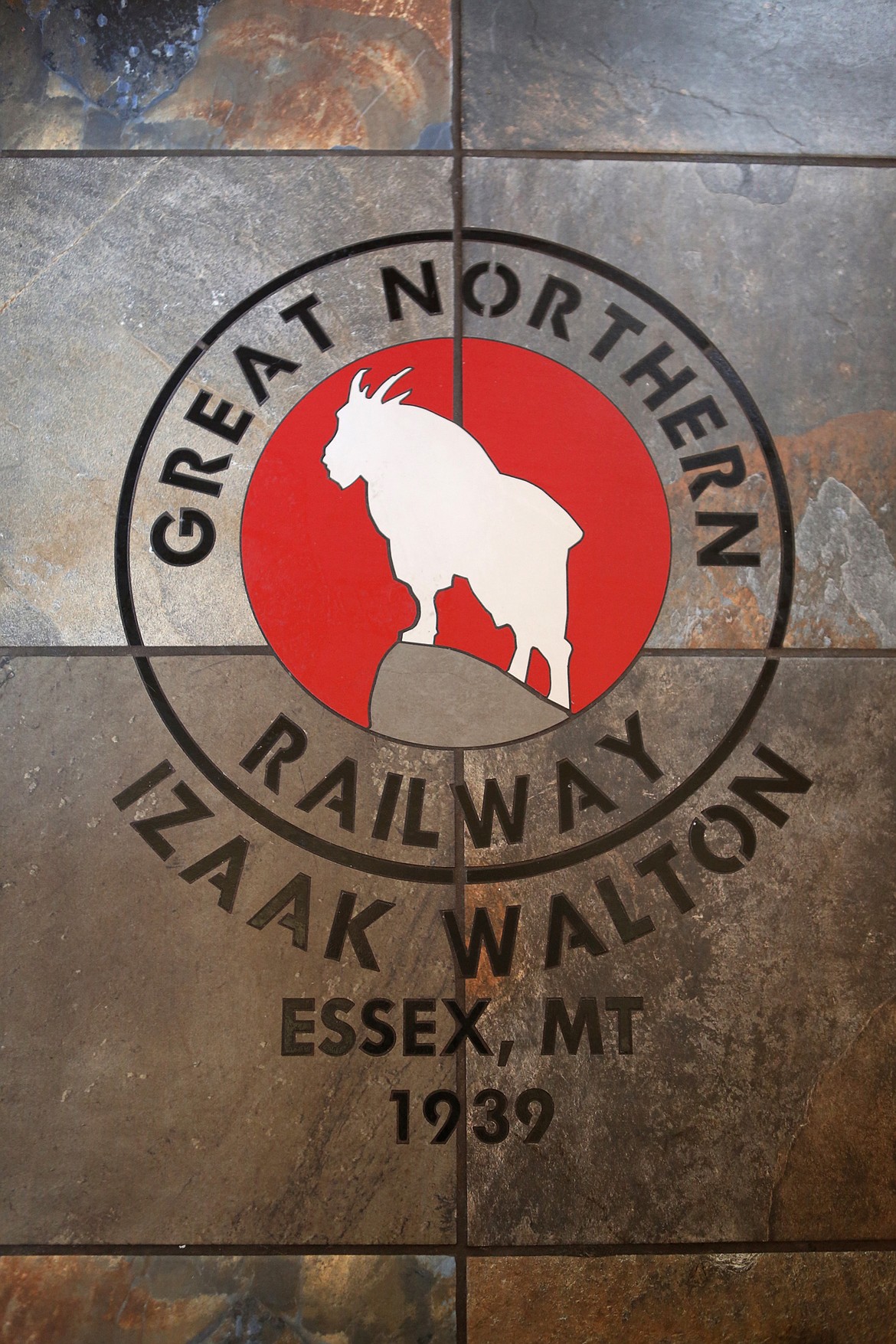 The floor of a luxury caboose features the Great Northern Railway logo. (Mackenzie Reiss/Daily Inter Lake)