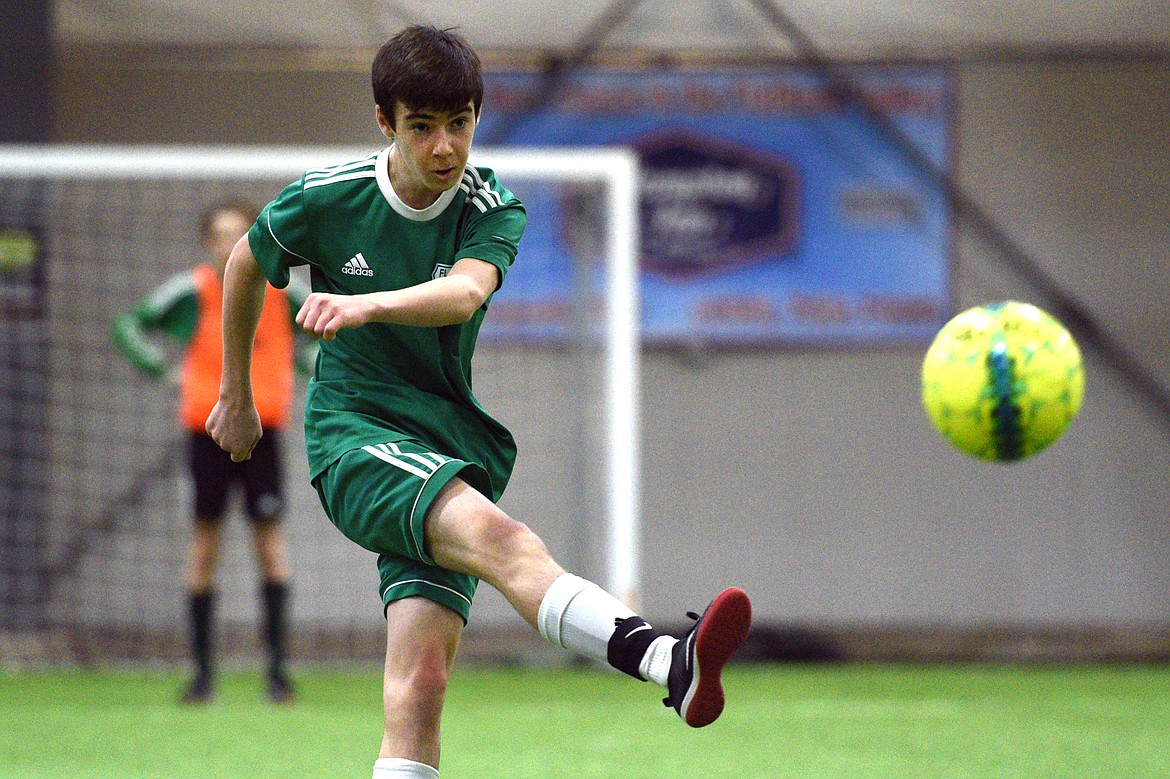 Flathead Force 03's Sol Dalla Betta plays the ball upfield against the Sandpoint Strikers during the Montana Indoor Soccer Championships at the Flathead County Fairgrounds on Saturday. (Casey Kreider/Daily Inter Lake)