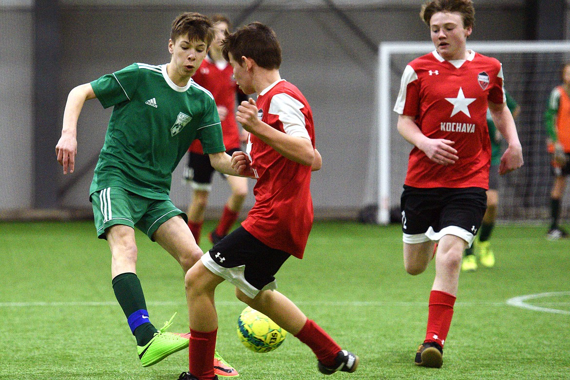 Flathead Force 03's Sol Dalla Betta passes to a teammate against the Sandpoint Strikers during the Montana Indoor Soccer Championships at the Flathead County Fairgrounds on Saturday. (Casey Kreider/Daily Inter Lake)