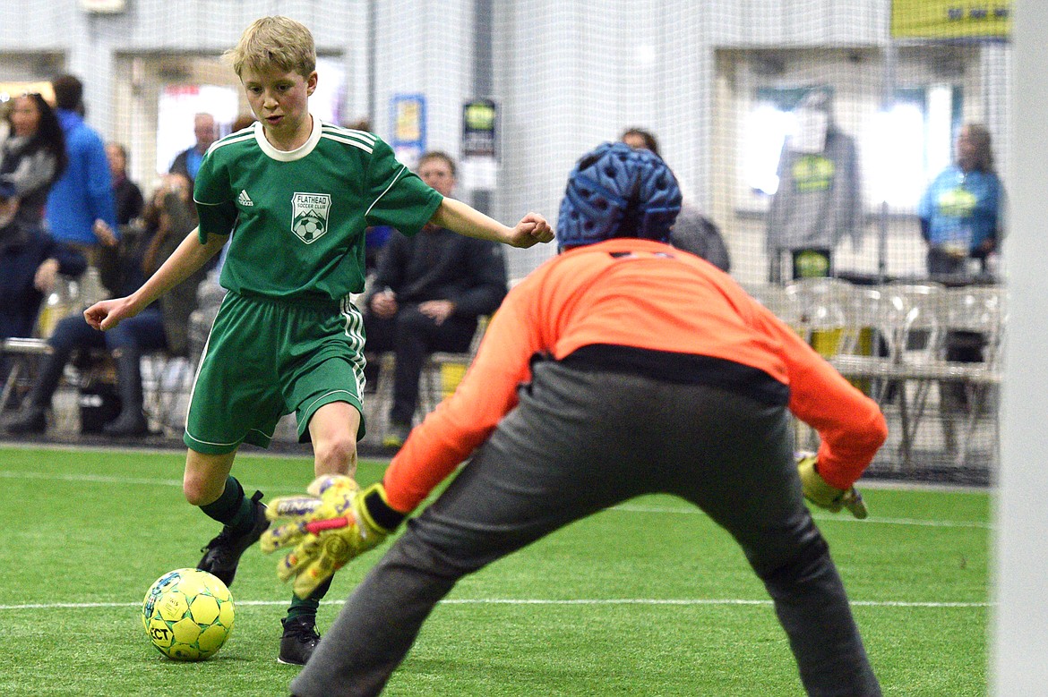 Flathead Force 03's Sam Ellis gets a shot on goal against the Sandpoint Strikers during the Montana Indoor Soccer Championships at the Flathead County Fairgrounds on Saturday. (Casey Kreider/Daily Inter Lake)