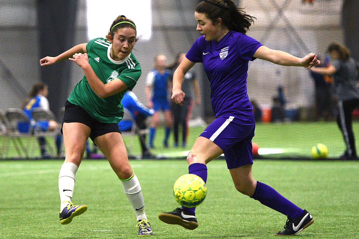 FVU Flathead Force's Gabby Dixon looks to shoot against NSC Purple 00 during the Montana Indoor Soccer Championships at the Flathead County Fairgrounds on Saturday. (Casey Kreider/Daily Inter Lake)