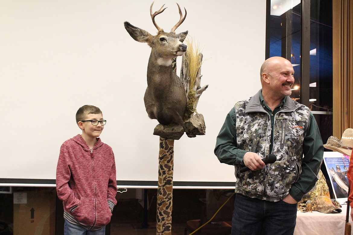 Cheryl Schweizer/Columbia Basin Herald
Riley Northrup (left) went hunting with Youth Outdoors Unlimited and was presented his trophy at the annual Moses Lake YOU banquet Saturday.