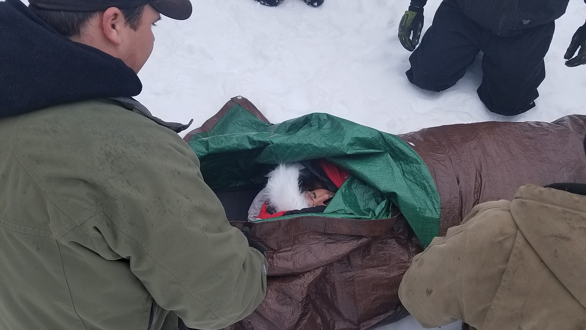 Photo by Mandi Bateman
A student poses as a hypothermia patient, enjoying the benefits of being toasty warm.