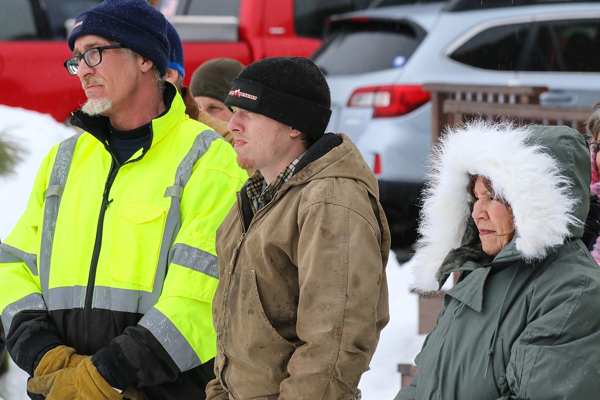 Photo by Mandi Bateman
Hall Mountain Volunteer Firefighters Andy Durette and Ben Allinger, and Hall Mountain Volunteer Fire Association Ladies Auxiliary Justine Williams, look on during an outdoor demonstration.