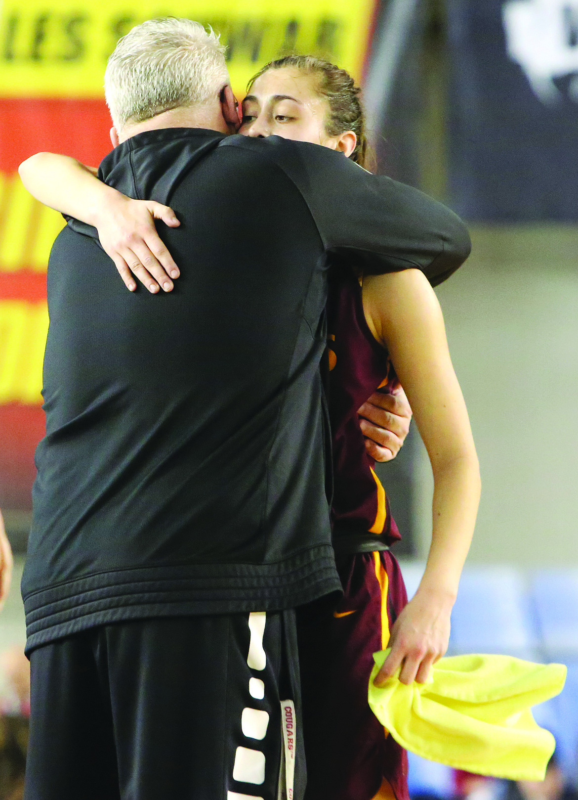 Connor Vanderweyst/Columbia Basin Herald
Jamie Loera and Moses Lake head coach Matt Strophy embrace in the fourth quarter against Eastlake after Loera checked out of her final high school game.