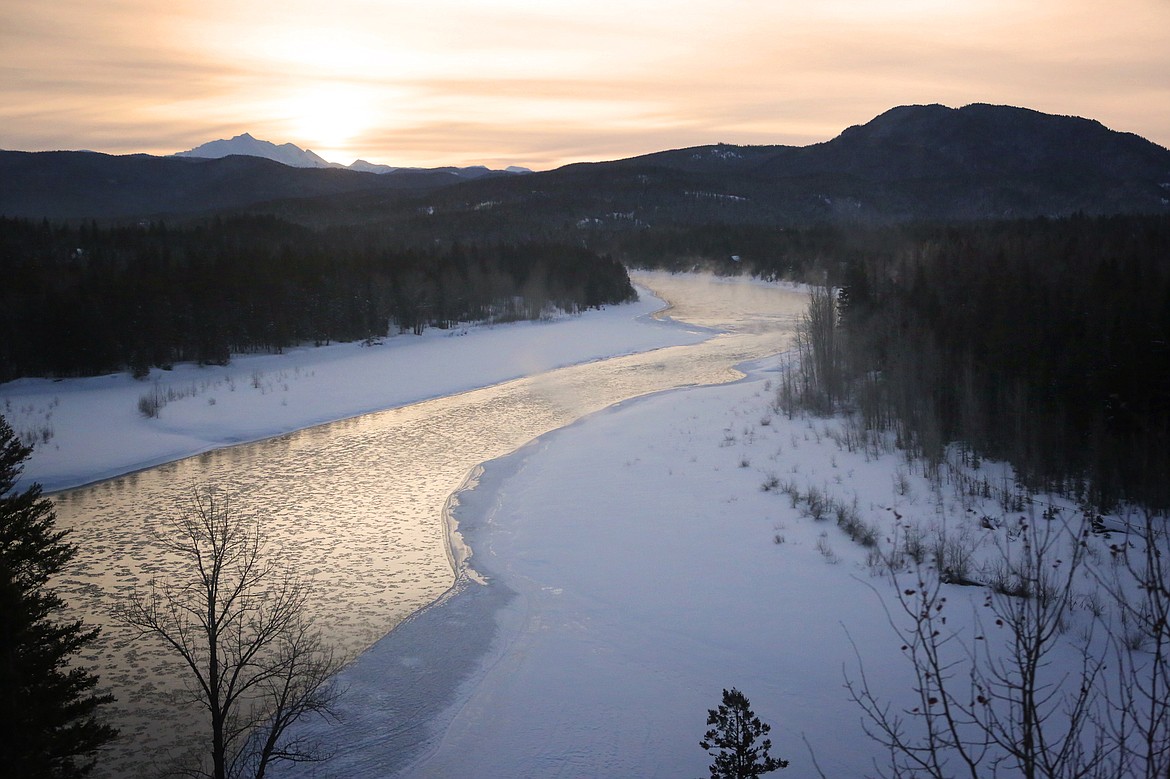 Steam rises off the Middle Fork of the Flathead River on Thursday, Feb. 22, as seen from the window of an Amtrak train bound for Essex. (Mackenzie Reiss/Daily Inter Lake)