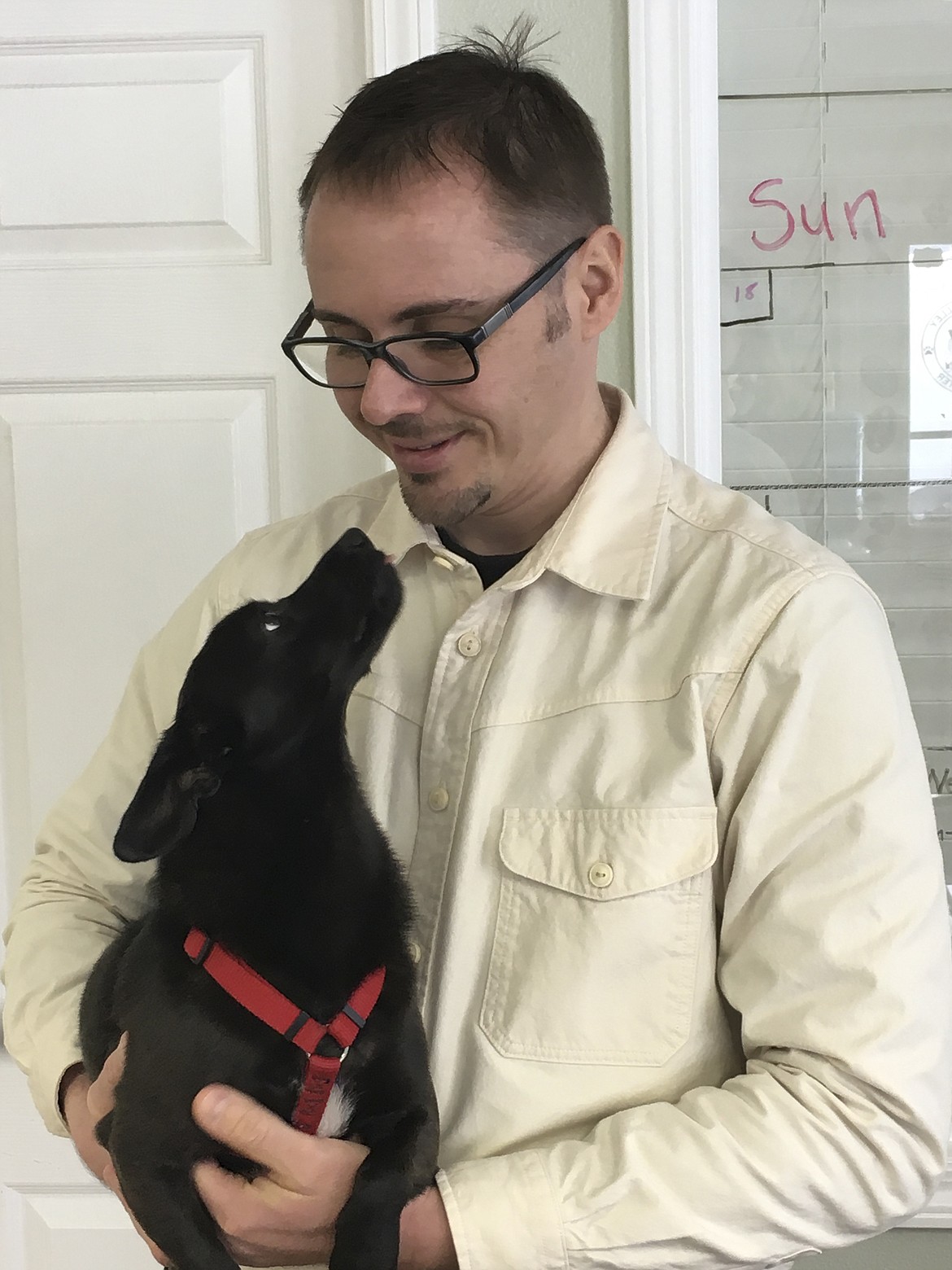 MISSION VALLEY Animal Shelter Director Filip Parusz holds Whibley, a Chihuahua mix. The shelter, which is under construction for additions, is usually double capacity of 15 dogs. (Ashley Fox/Lake County Leader)