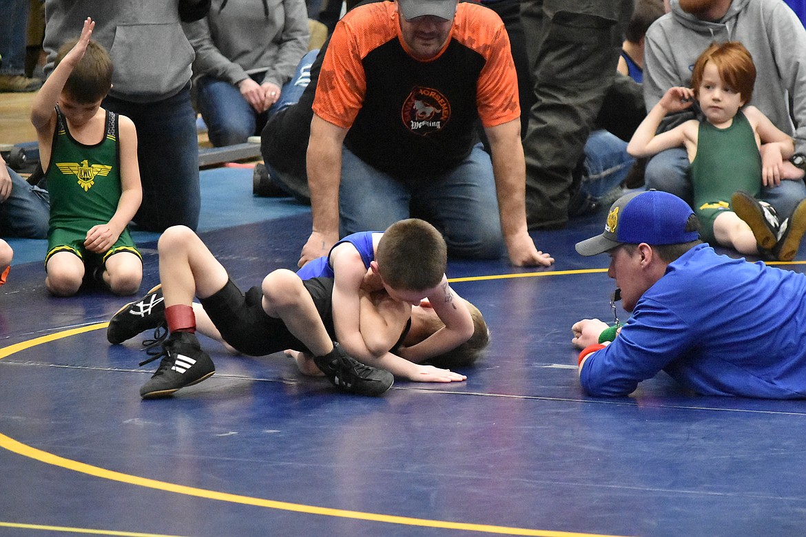 Eli Rayome attempts to pin his opponent during the Kootenai Klassic, March 3.