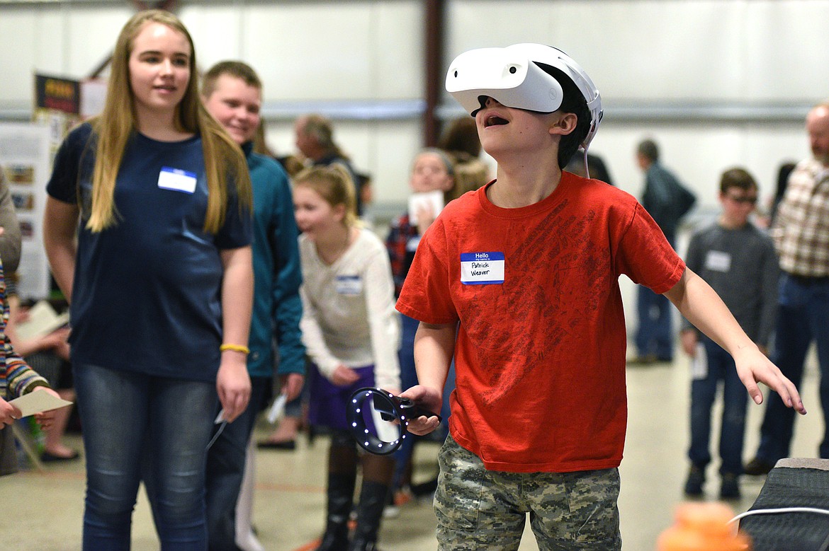 Patrick Weaver, a fifth-grader at Glacier Gateway Elementary, enjoys Park Side Credit Union&#146;s virtual reality station that simulates an underwater ocean experience at the Flathead County Science Fair on Thursday.