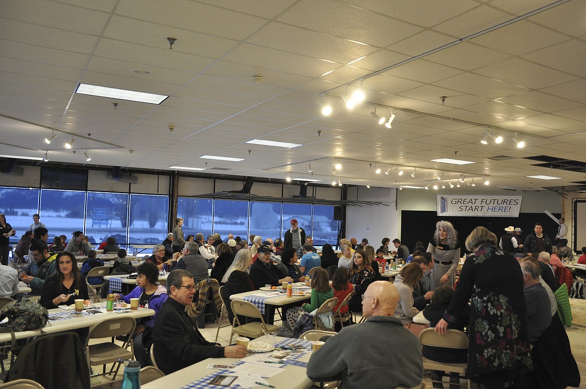 MORE THAN 200 people including community members, elected officials and families from the Boys and Girls Club attend a breakfast at the club&#146;s new building in Ronan last week. (Ashley Fox/Lake County Leader)

RIGHT PHOTO: ARIC COOKSLEY, director of the Boys and Girls Club, talks to a crowd of 200 at a &#147;friend-raiser&#148; breakfast at the club&#146;s new location, the former Total Home store in Ronan. (Ashley Fox/Lake County Leader)

BELOW PHOTO: VOLUNTEERS SERVE community members during the Boys and Girls Club &#147;friend-raiser&#148; breakfast on Feb. 28 at the club&#146;s new building, the former Total Home store in Ronan. (Ashley Fox/Lake County Leader)