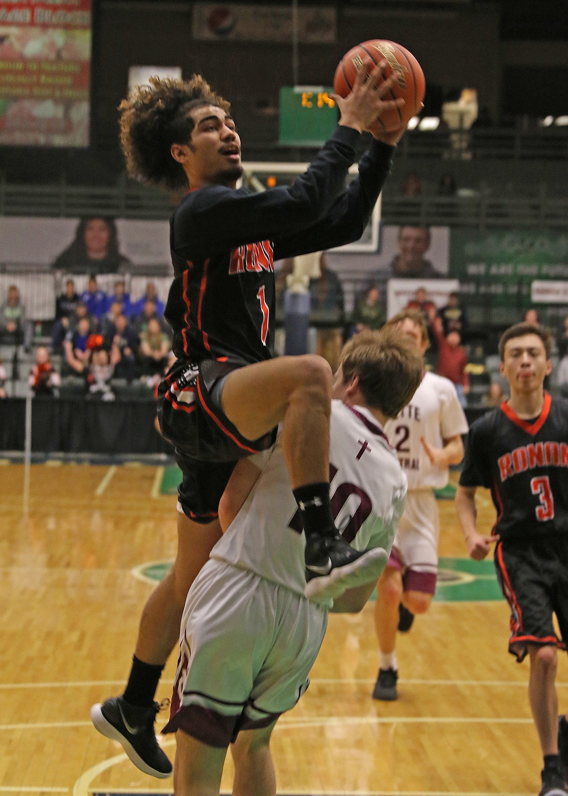 RONAN HIGH School basketball player Ezekiel Misa drives to the basket in the Chiefs&#146; consolation bracket game against Butte Central Saturday morning at the Butte Civic Center. (photo courtesy of Bob Gunderson)