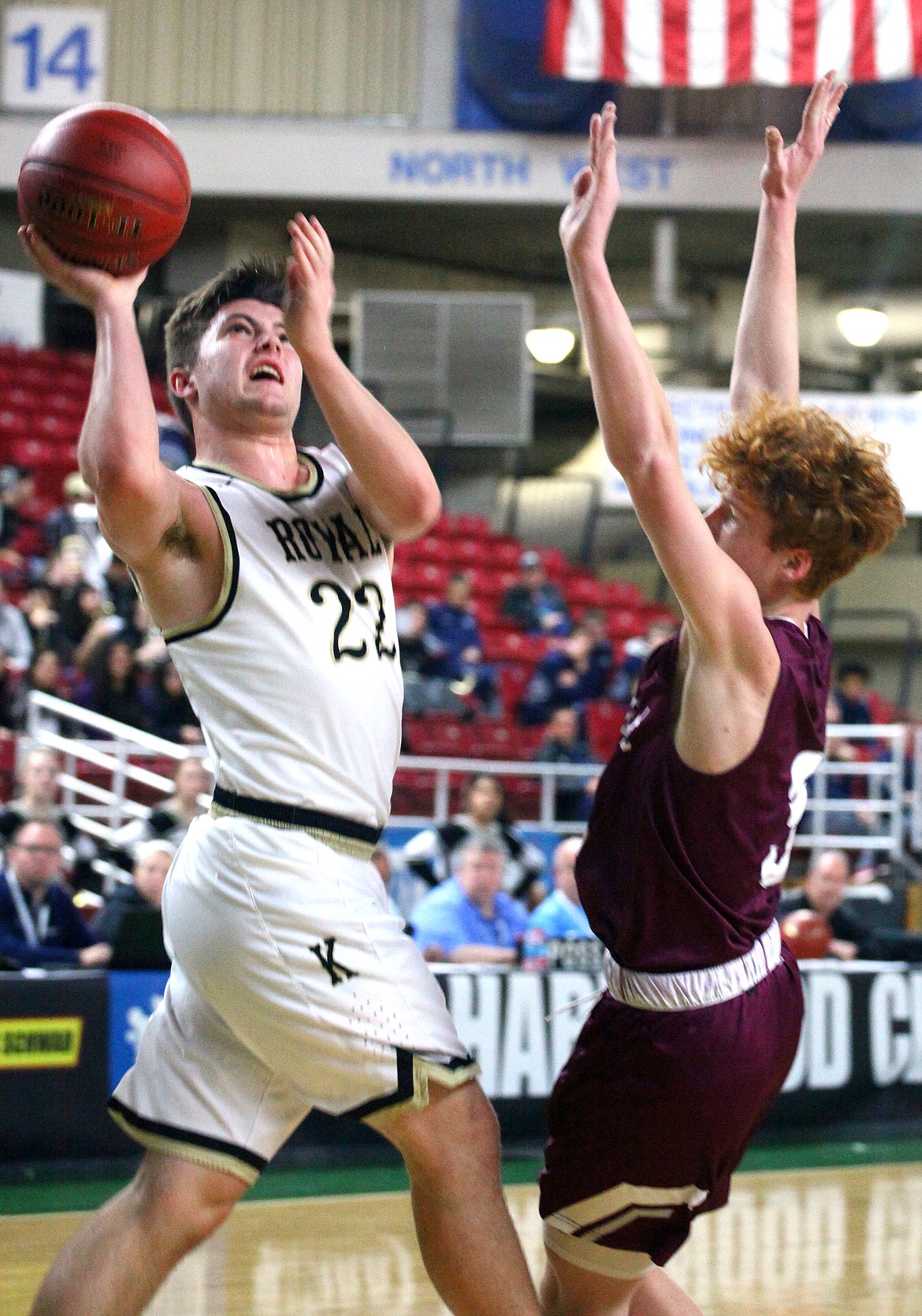 Rodney Harwood/Columbia Basin Herald
Royal guard Isaac Ellis (22) goes strong to the basket against a Northwest School defender during Thursday&#146;s game at the 1A Hardwood Classic at the Yakima SunDome.