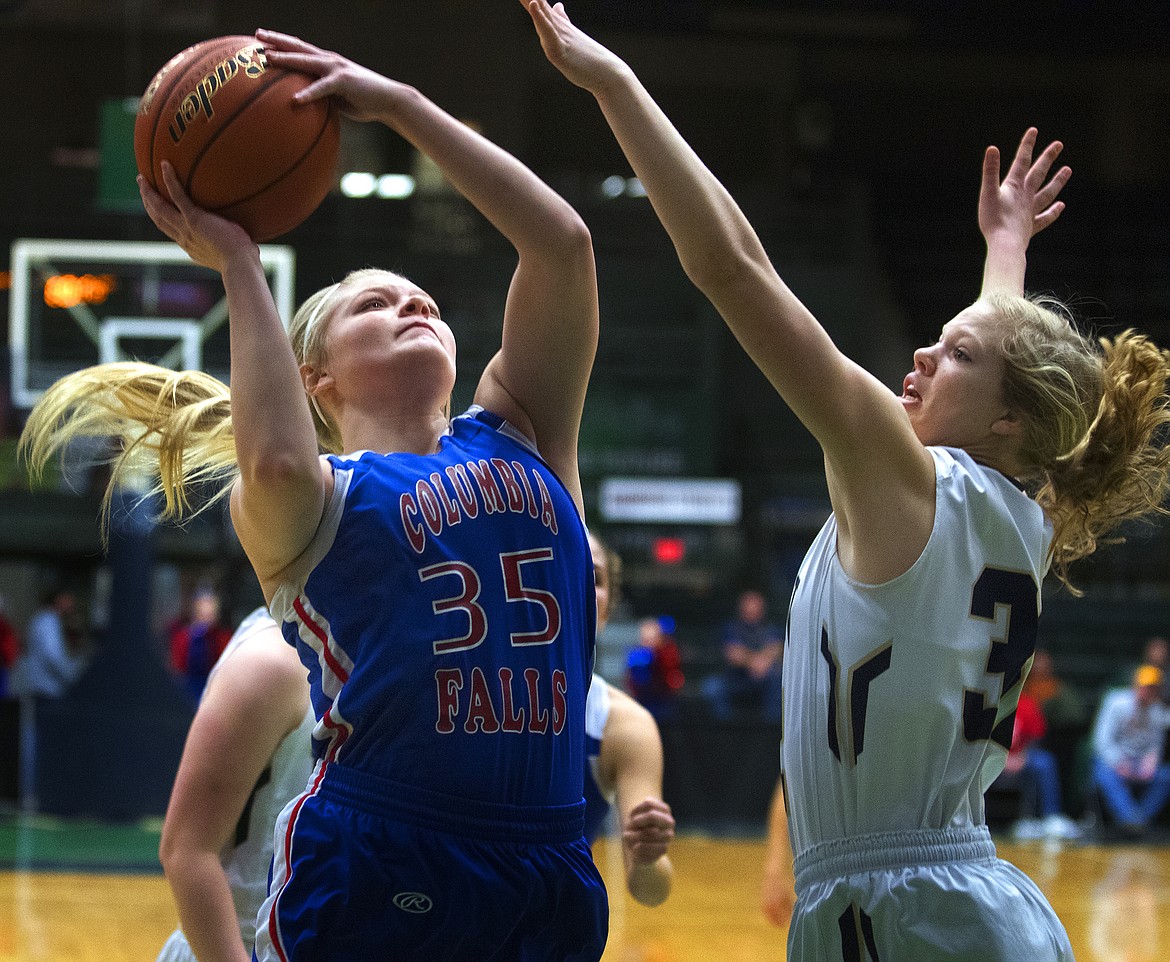 Trista Cowan goes up for a shot against Dillon in Western A Divisional Tournament Saturday. (Jeremy Weber photo)