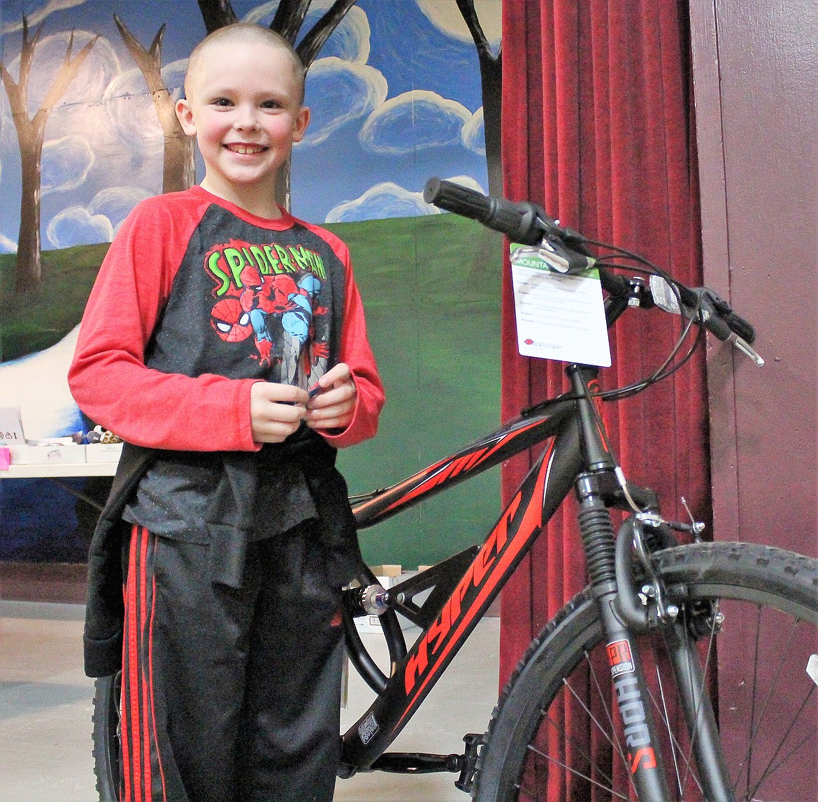 Alberton student Jaxson Zimmerman won a bike donated from the Masons Lodge in Superior as part of the school&#146;s &#147;I Love to Read Month.&#148; (Photo by Rochelle Knapp)