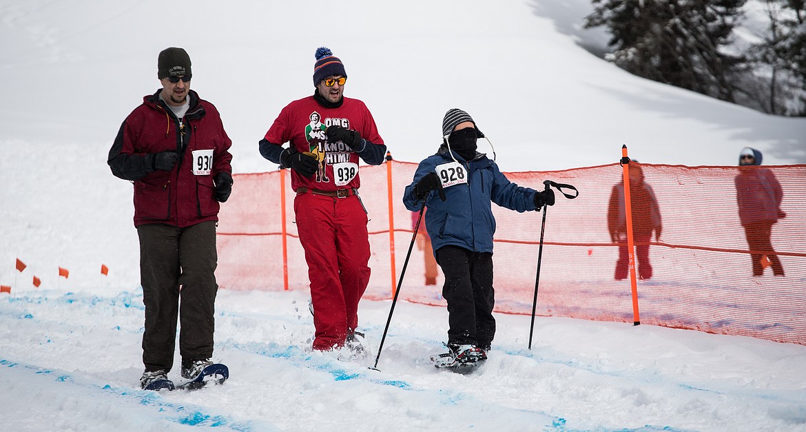 Tucker Negron, Sean O&#146;Neill and Michael Jones race to the finish in snowshoeing at the 2018 Special Olympics Montana Winter Games at Whitefish Mountain Resort.