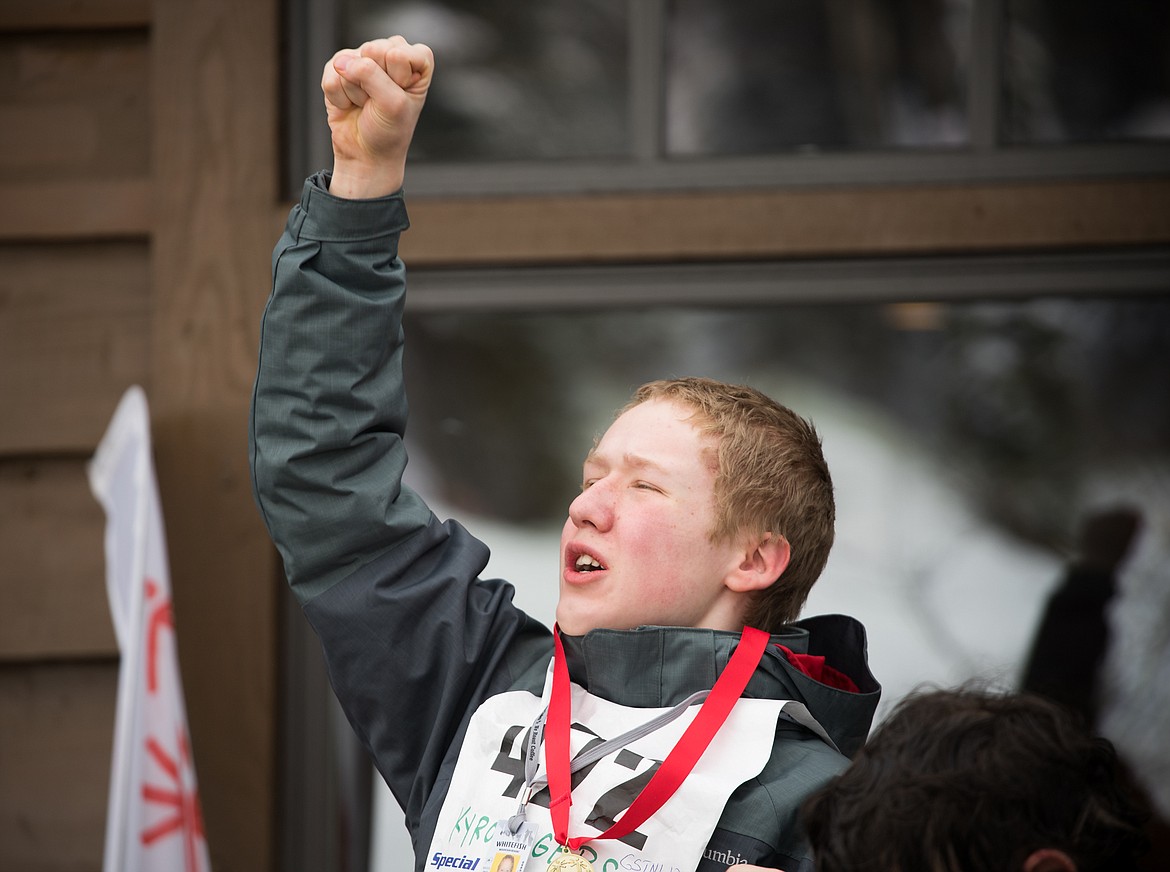 Kyro Rogers of Kalispell celebrates his gold medal on the podium at the 2018 Special Olympics Montana Winter Games.