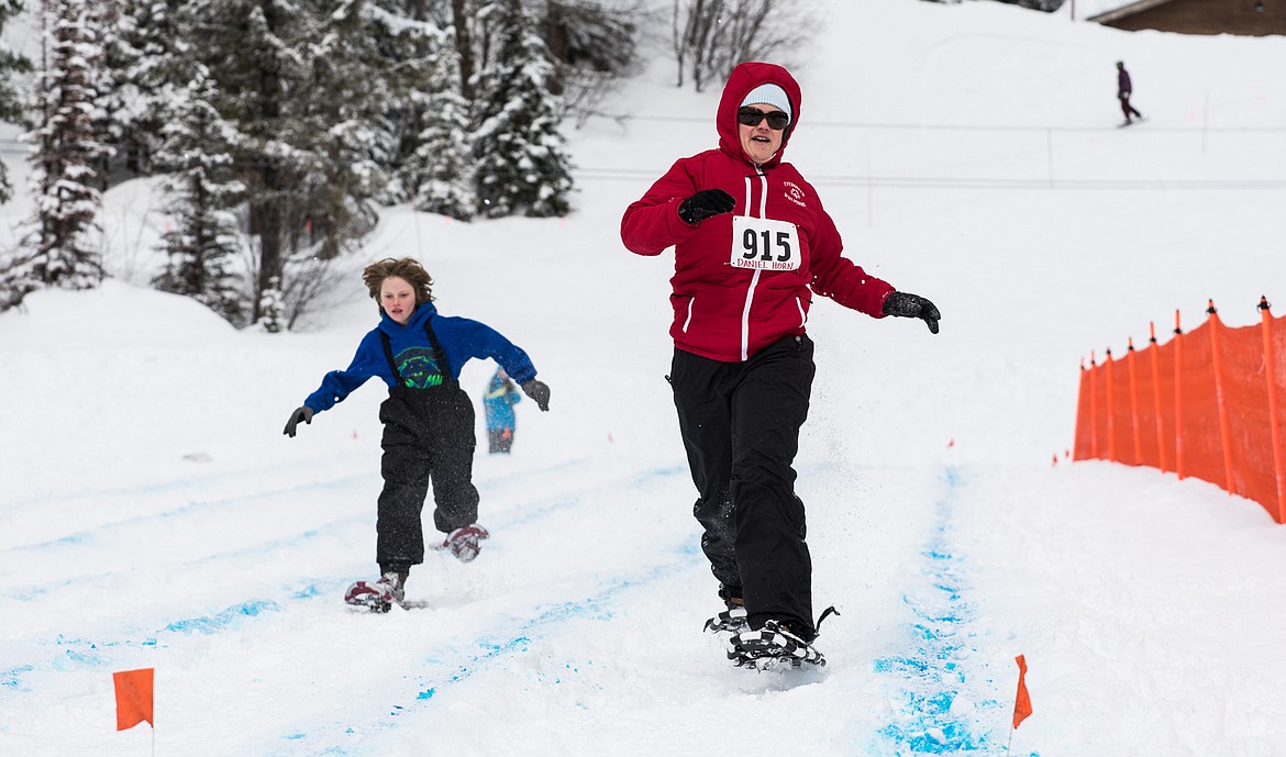 Daniel Horn of Evergreen approaches the final turn during a snowshoe relay race.