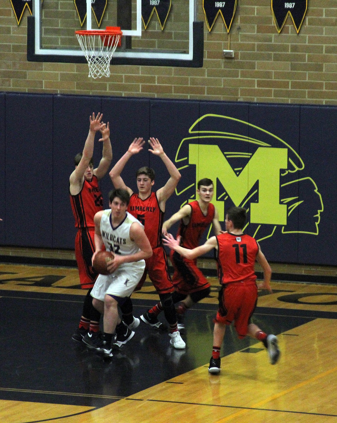 Gavin Luna pulls down a rebound over the entire Kimberly team during the second half of the Wildcats 48-45 loss to the Bulldogs.