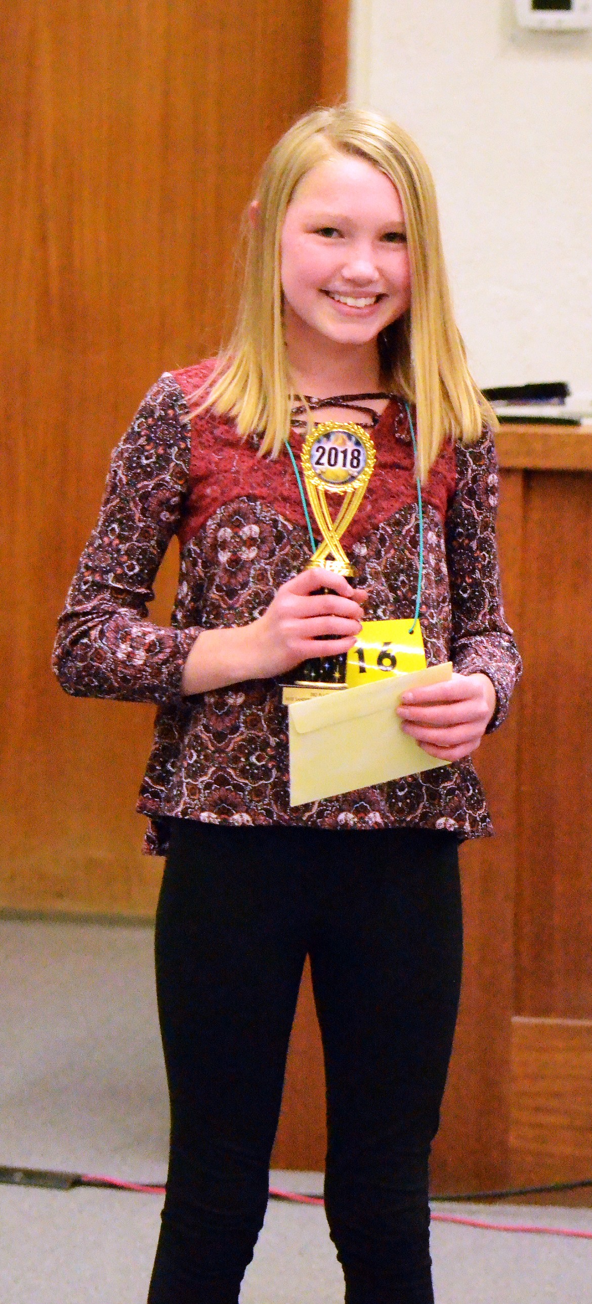 Third-place winner Piper Bergstrom of Plains holds her trophy.