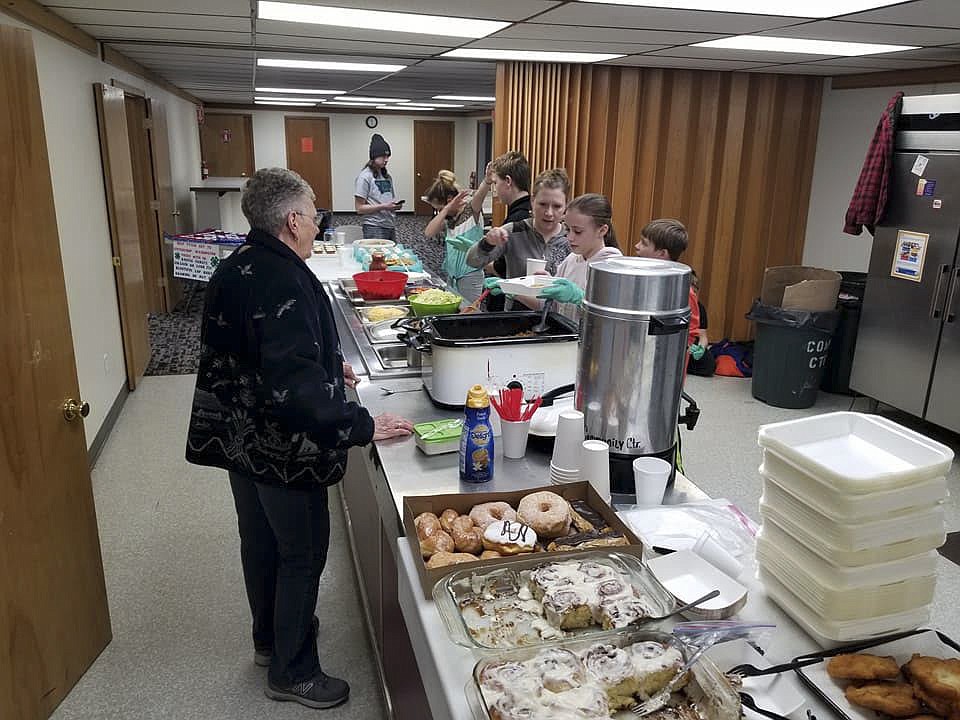 STUDENTS FROM the 4H Aerospace Project served more than 50 Indian Tacos and 12 gallons of coffee during The Leader's annual trade show last week. (Photo courtesy of Eric Kendall)