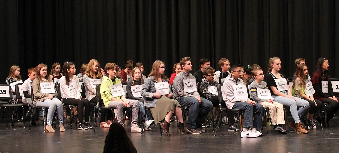 Nearly 40 fourth- through eighth-graders take their seats on stage Saturday morning in the  North Idaho College Schuler Performing Arts Center at the start of the 15th annual North Idaho Regional Spelling Bee. The participants came from 40 schools in nine districts across North Idaho, including private and home school. Each student received a medallion and NIC event passes. (DEVIN WEEKS/Press)