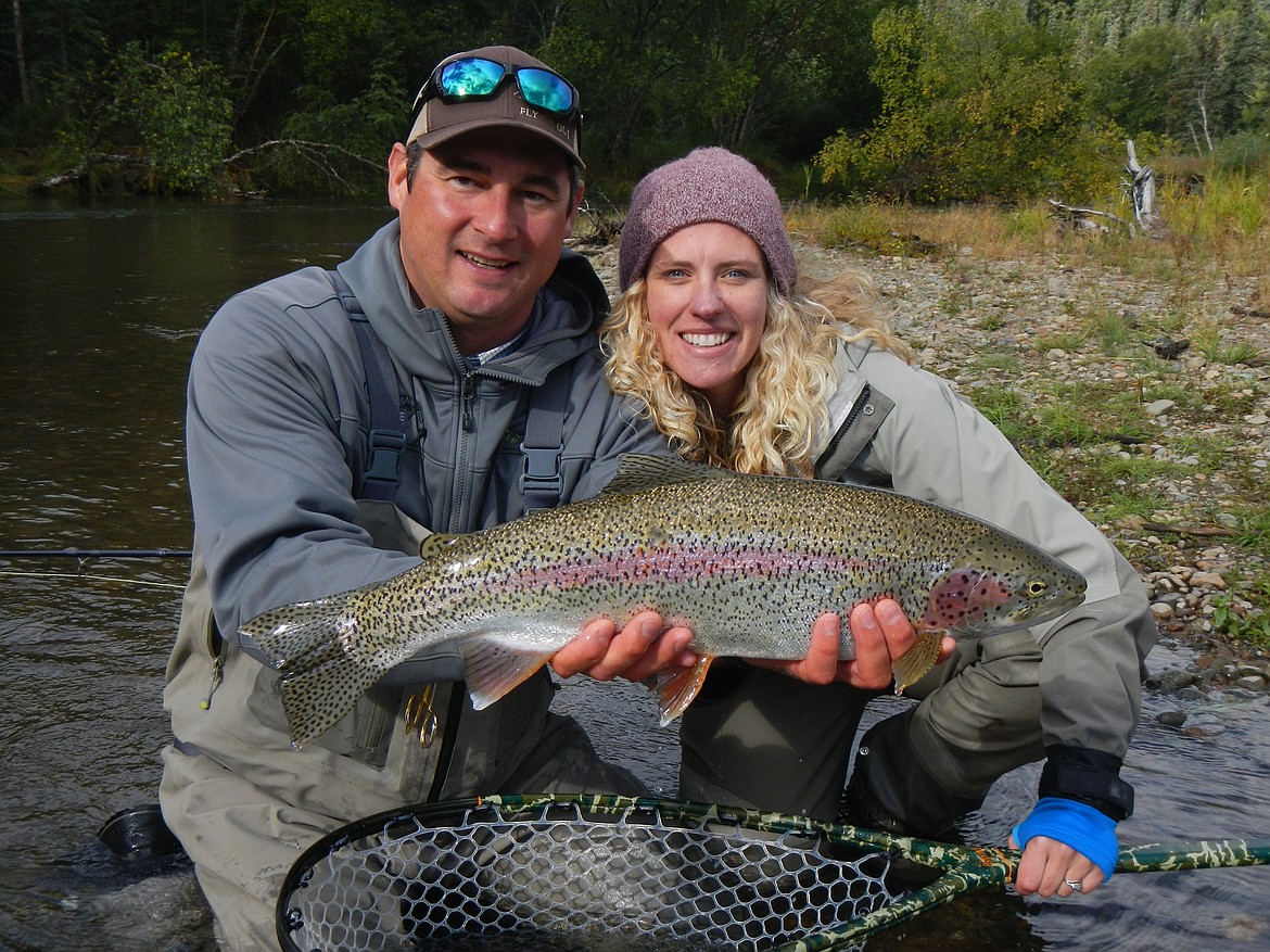 Heather Oberholtzer (right) and her husband, Alex, with a Rainbow Trout caught at Crystal Creek Lodge in Bristol Bay, Alaska.