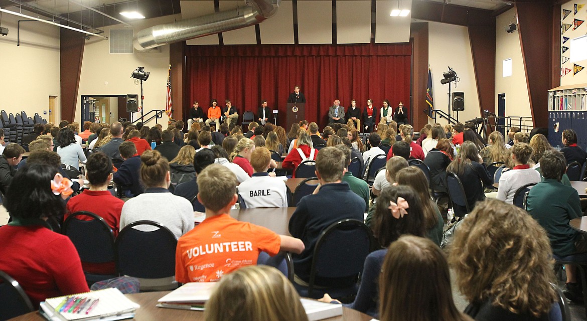 Well more than 100 students packed into the commons of Coeur d'Alene Charter Academy to hear their peers speak Wednesday morning during the national high school walkout event. At the podium, freshman Max Wilderson spoke about the implications of arming America's teachers. (DEVIN WEEKS/Press)