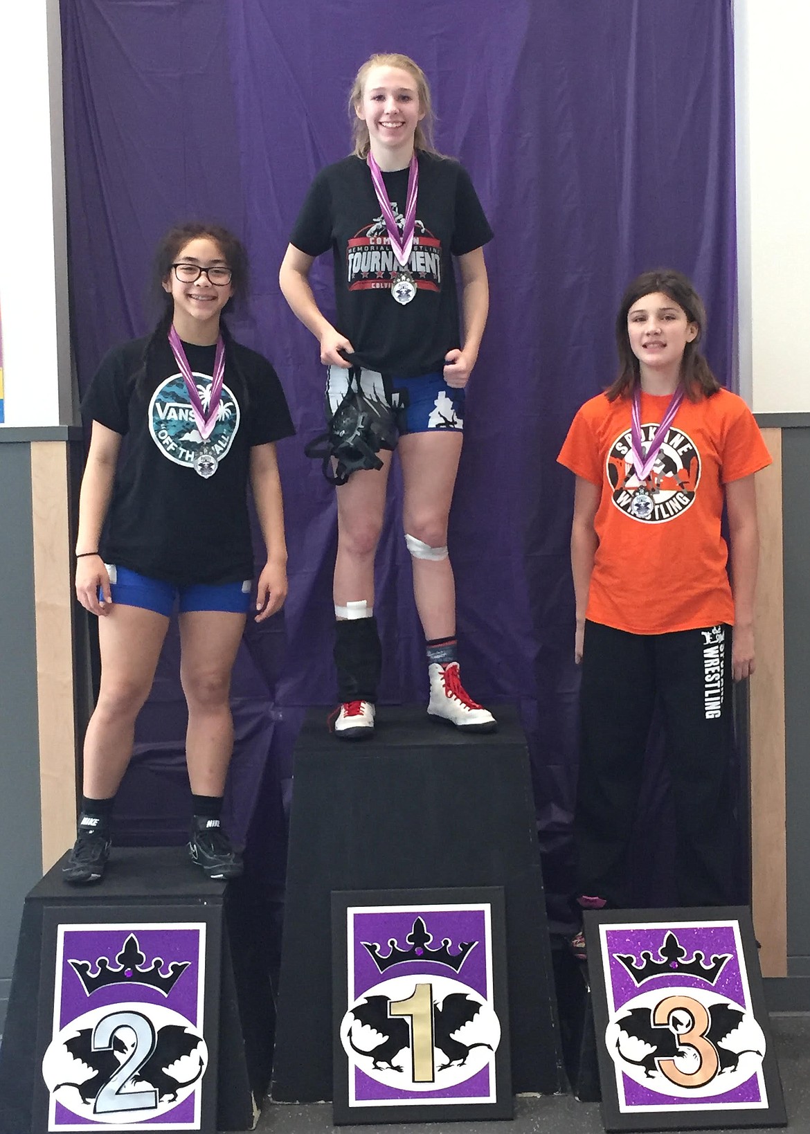 (Courtesy photo)
Top Dog wrestler Kayelin Johansen, middle, took first place last weekend as the lone Idaho placer in the 119 pound division during the Washington Women&#146;s Wrestling series Battle for the Bling tournament. The win followed a second place finish last weekend in both Folkstyle and Freestyle, with the series set to wrap up in Mt. Vernon, Washington in April. Johansen has been training with Top Dog Wrestling and the Idaho State Women&#146;s Team, and leaves next Thursday for the U.S. Marine Corps Women&#146;s National Folkstyle Championships in Oklahoma City. This will be the first time all 50 states will be represented by women wrestlers from middle school through college.