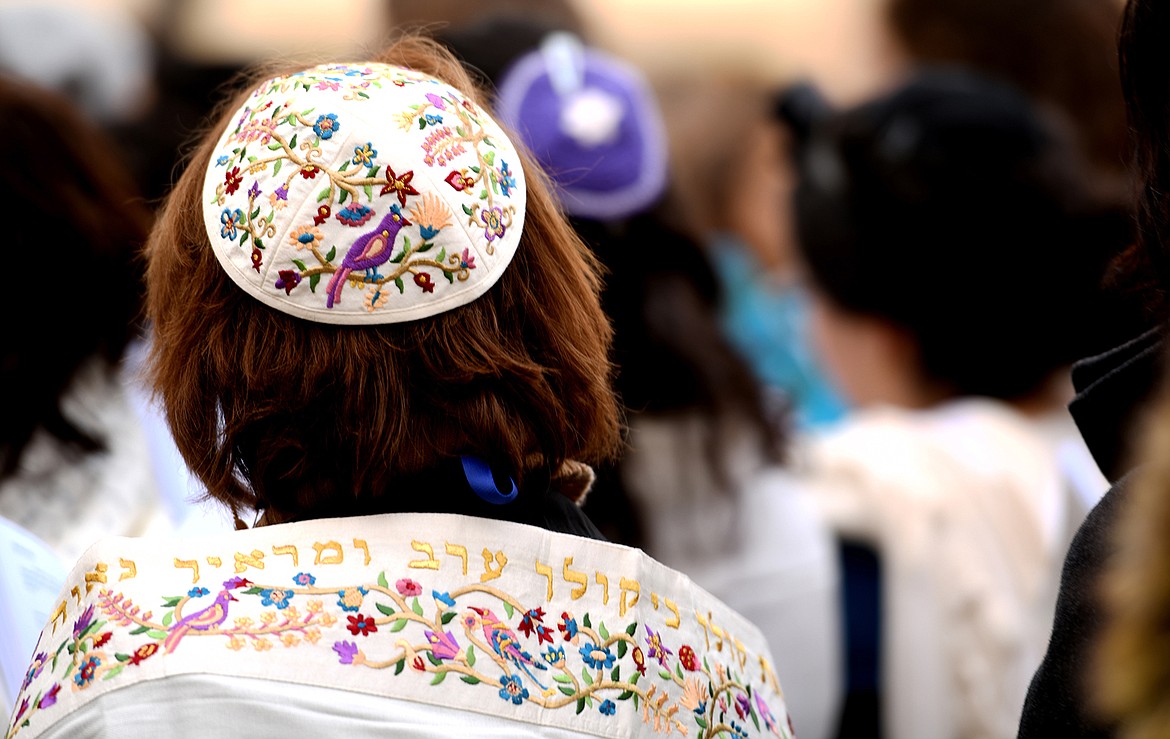 A woman wears a Women of the Wall Garden of Eden Tallit to show her support for the feminist organization working for religious pluralism at the Western Wall which wold allow all Jewish women to worship as they choose. The embroidered Hebrew calligraphy is from the Song of Solomon. &#147;Let me hear your voice, for your voice is fair and your face is lovely.&#148; Women have reduced space at the Wall and are restricted from praying out loud and reading the Torah.(Brenda Ahearn/Daily Inter Lake)