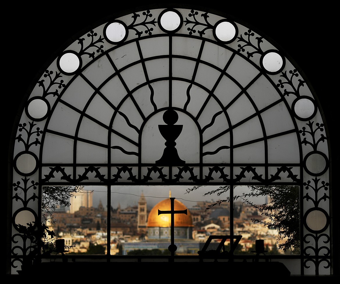 View of Jerusalem and the Dome of the Rock as seen through the window of Roman Catholic church Dominus Flevit, which means &#147;The Lord Wept.&#148;(Brenda Ahearn/Daily Inter Lake)